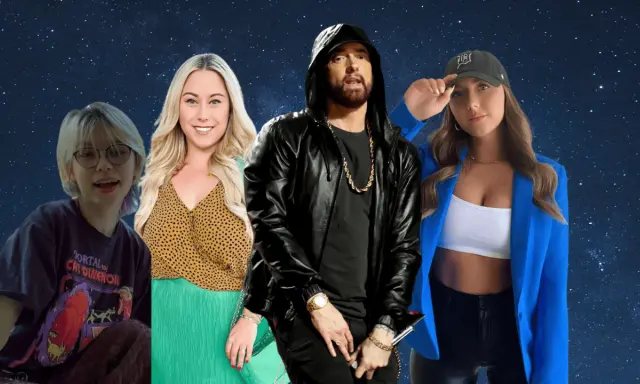 Eminem w czarnej kurtce i złotej biżuterii, otoczony przez trzy kobiety. Czy Eminem ma zone?
