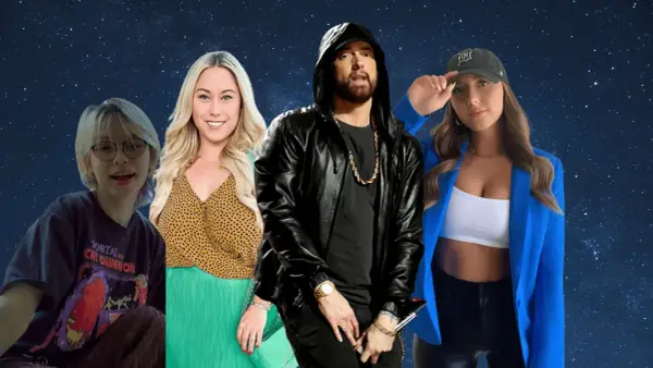 Eminem w czarnej kurtce i złotej biżuterii, otoczony przez trzy kobiety. Czy Eminem ma zone?